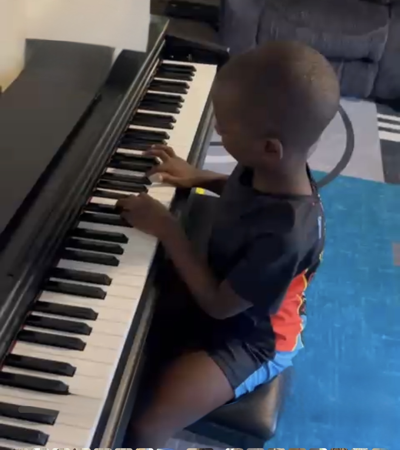 My Son enjoying keyboards of piano
