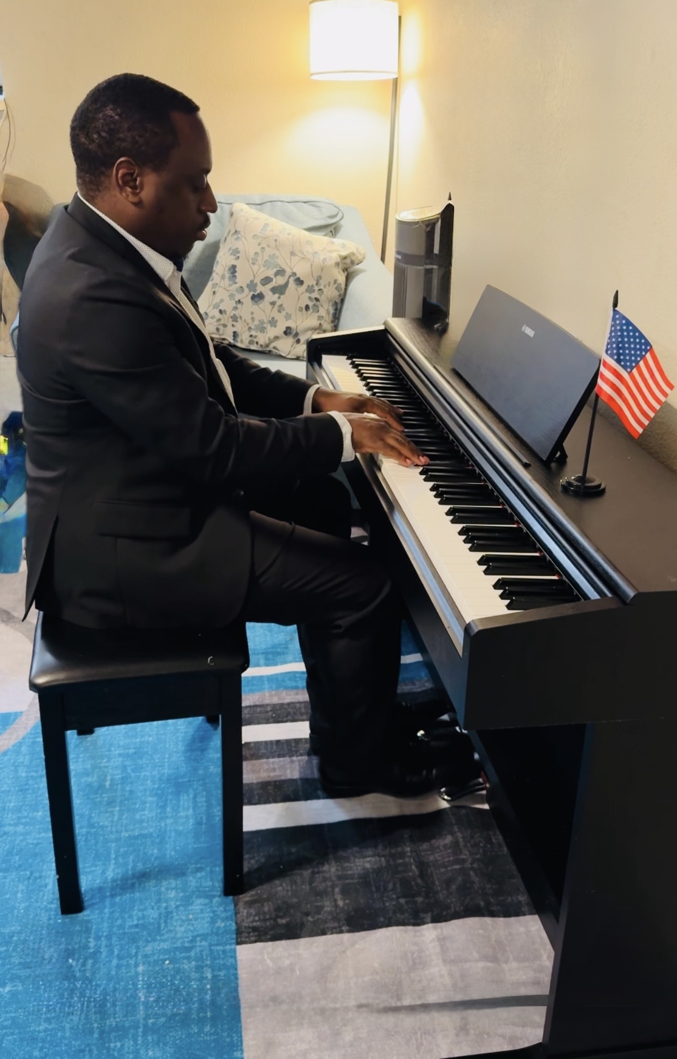 Parent sitting on piano